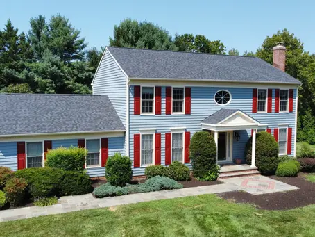 blue house with red shutters
