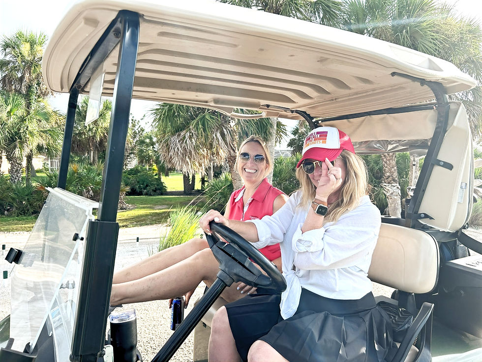 Ladies driving the golf cart