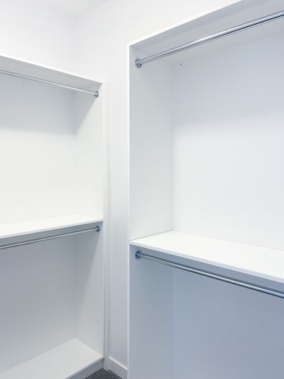 Clean and organized white closet storage design from Imperial Cabinet in Winnipeg, Manitoba