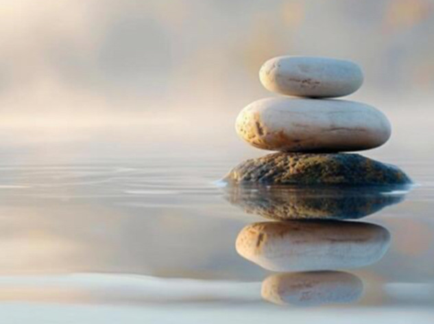 smooth-stones-stacked-in-balance-on-calm