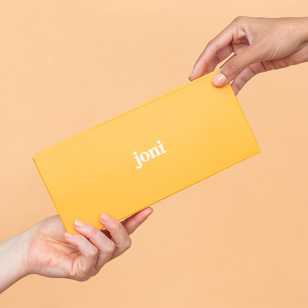 Two hands hold a box of joni bamboo plastic free pads