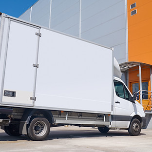 lorry-standing-outdoors-near-warehouse.jpg