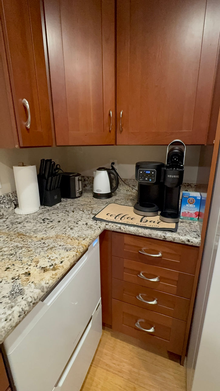 Fully equipped kitchen showing Keurig coffee station