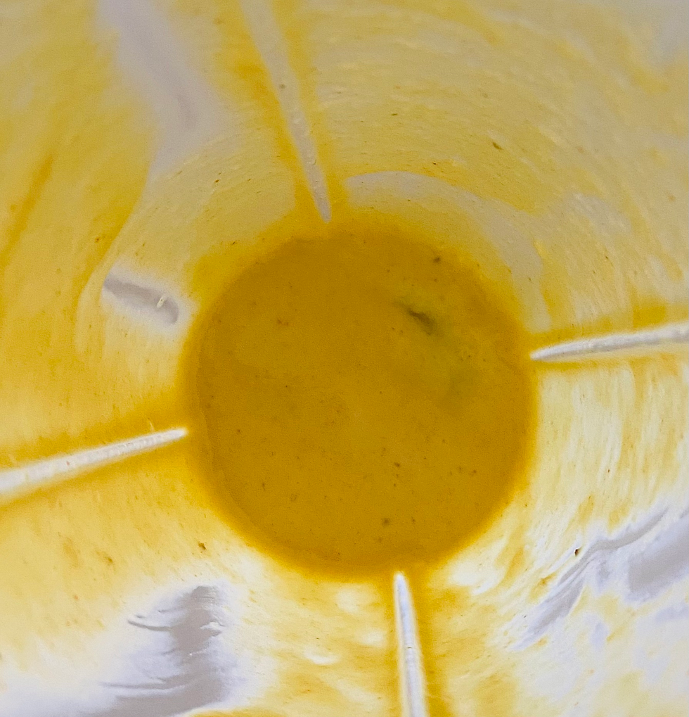 Yellow Blended banana honey mustard in a blender