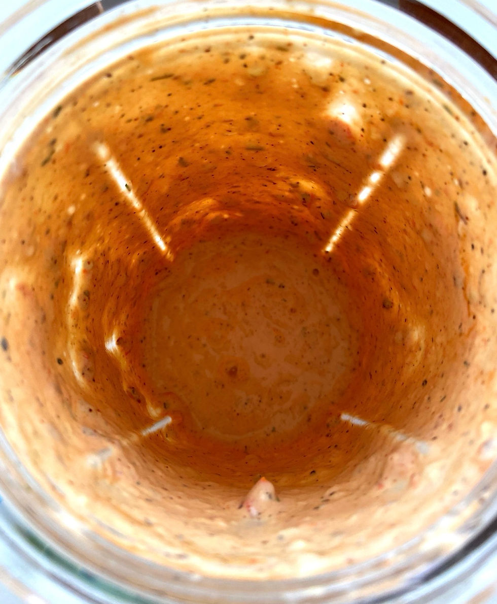 All of the ingredients for the bloody Mary remoulade blended in a blender into a red sauce