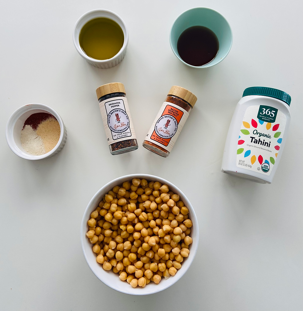 All of the ingredients for hummus on white table