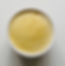 Banana hot sauce in a ramekin on a white table