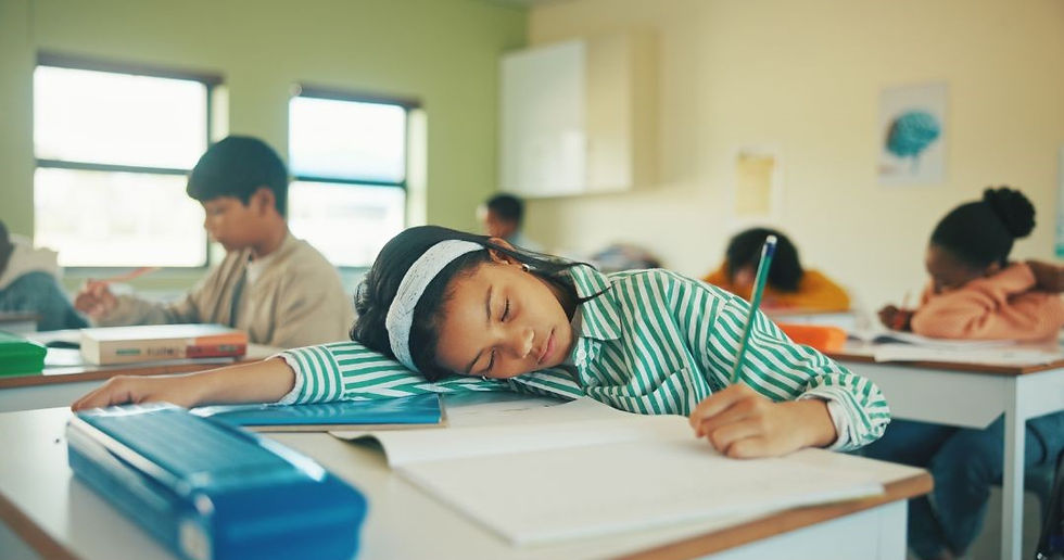 A student asleep in class.