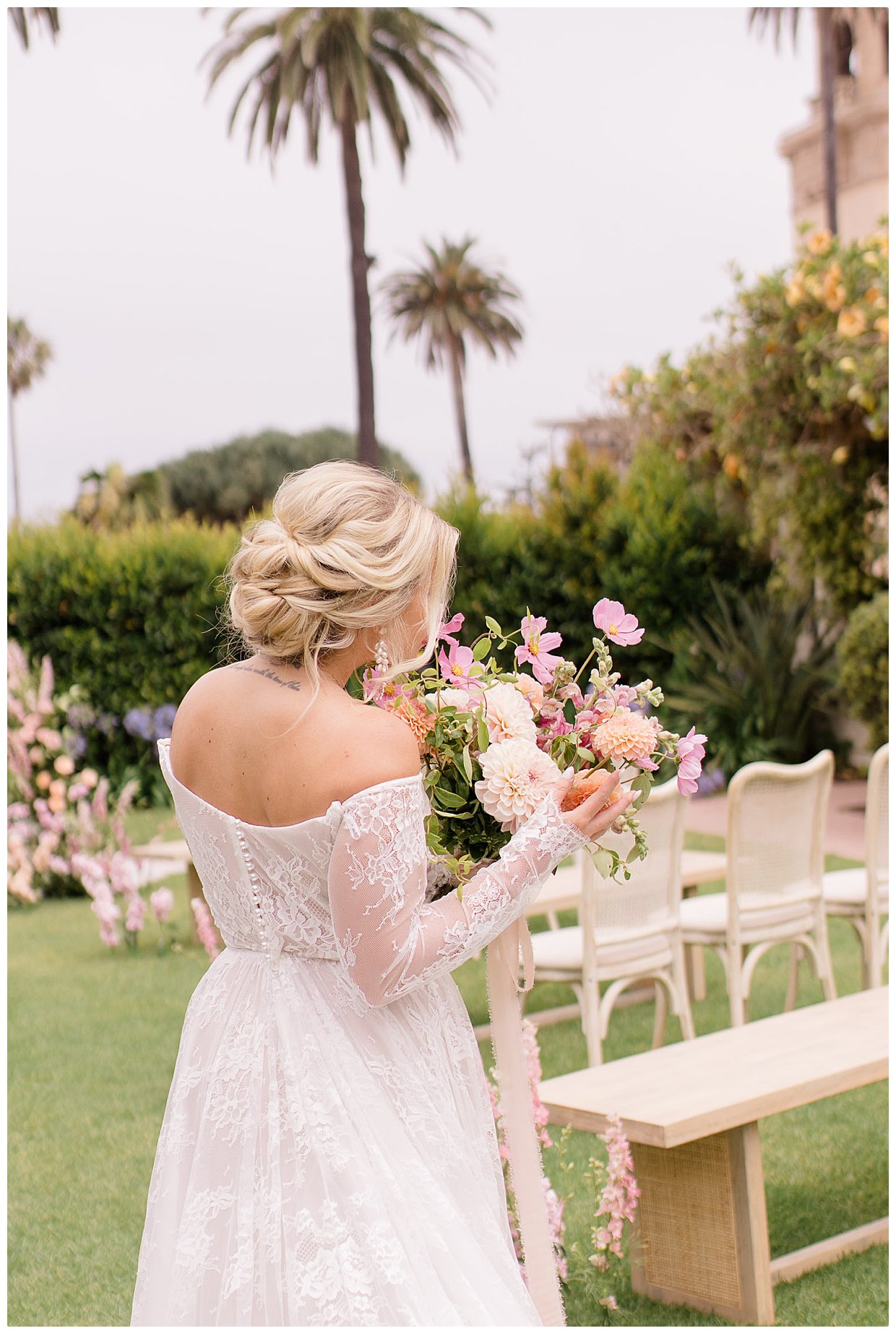 Bride in a white lace with long sleeved dress.