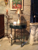 Round table with lamp stone wall background antique furniture modern classic