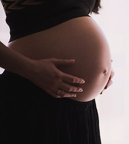 pregnant woman massaging tummy