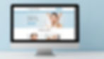 Monitor exibindo site da Clínica Fisiocare com serviços de estética.