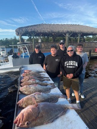 Fort Myers offshore fishing charter catching red grouper 35 miles offshore