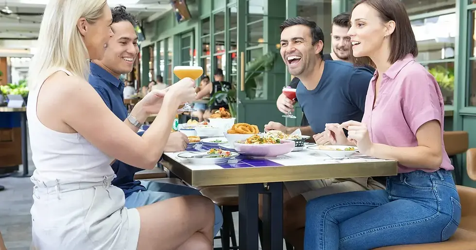 Friends watching the footy at a Gold Coast bar during NRL and AFL finals season.