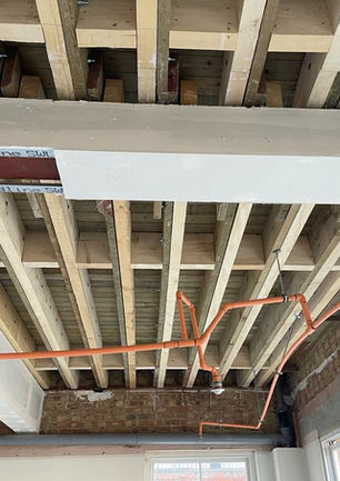 A section of 50m2 of additional 225*75 joists bolted alongside existing joist to accommodate additional loading for new roof terrace above. Belgravia, London