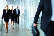 Businesspeople walking in hallway