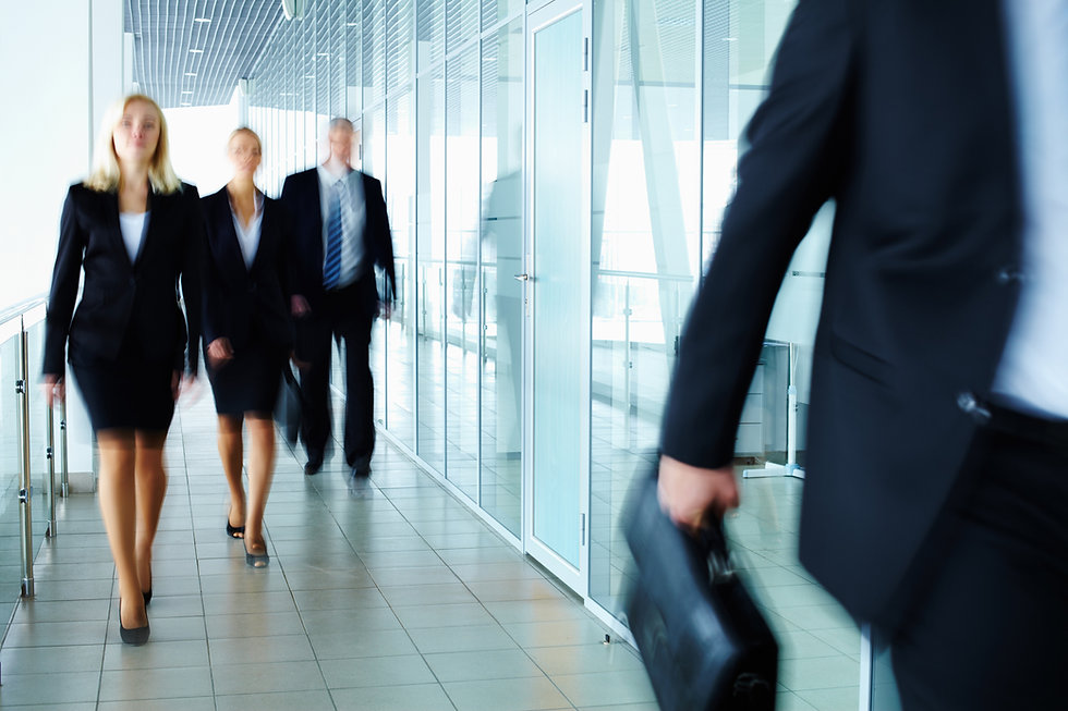 Businesspeople walking in hallway