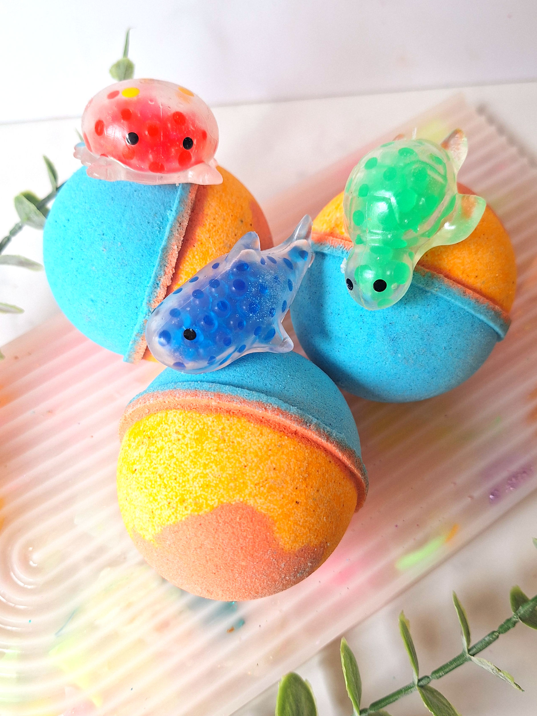 Large blue orange and yellow ocean bath bomb balls with hidden squishy sea animal toys