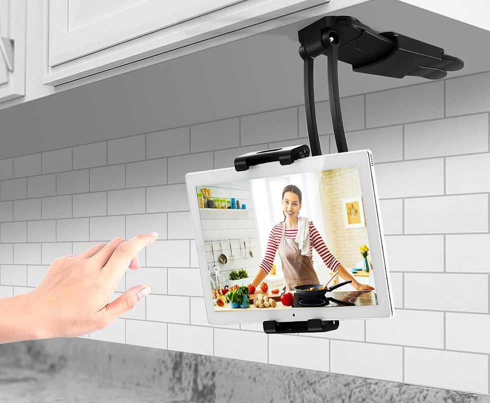 Tablet computer attached to a black metal mount attached under a kitchen cabinet