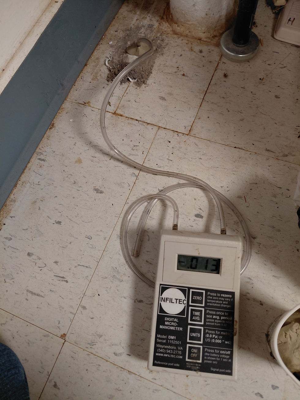 A technician performs pressure field extension testing to evaluate how effectively suction travels beneath the foundation. These measurements help determine whether the mitigation system is properly designed or if additional suction points may be needed.