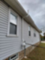 A typical active sub-slab depressurization system venting radon gas safely above the roofline.