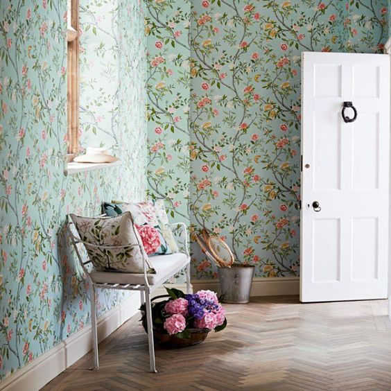 Beautiful hallway featuring Zoffany Nostell Priory wallpaper in Sky, styled with a white bench, floral cushions, and natural decor elements for a timeless and serene look - Pure Paint & Wallpaper Ireland