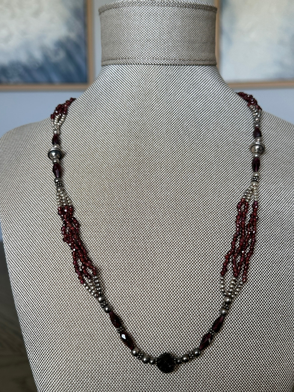 Handcrafted 24-inch sterling silver necklace with garnet gemstones and sterling silver beads, close-up view