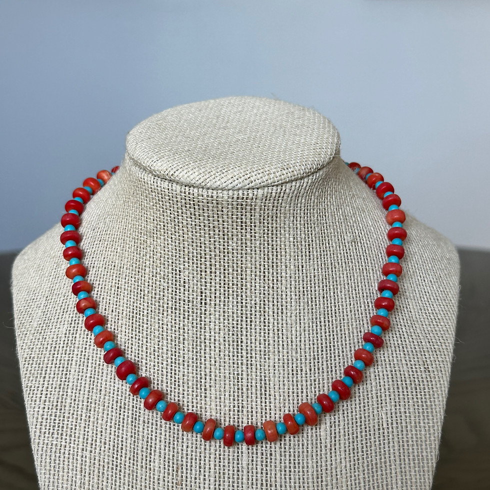 Thumbnail: Close up of Handcrafted 16-inch sterling silver necklace with coral and turquoise beads by Driftwood Beach Boutique
