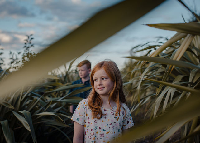 Child portrait outdoors in soft light – lifestyle portrait photography NZ