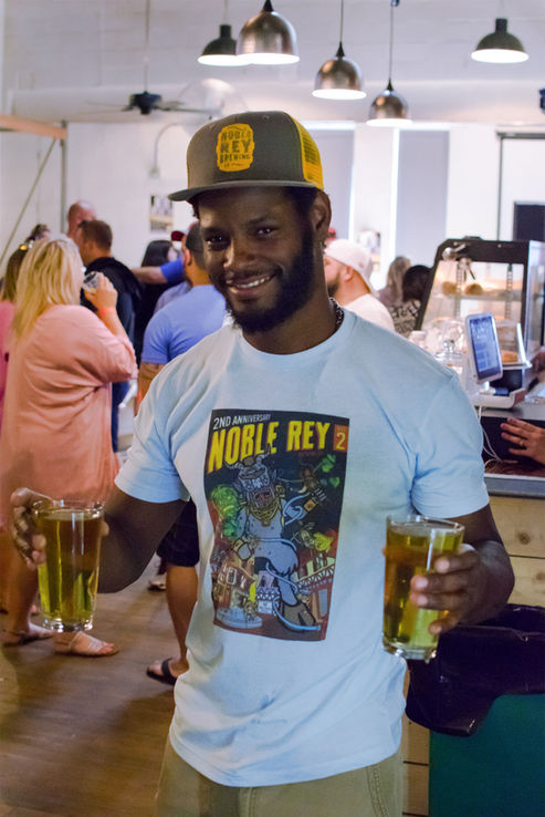 Event server wearing his poster t-shirt
