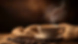 steaming-cup-coffee-with-coffee-beans-rustic-table.jpg