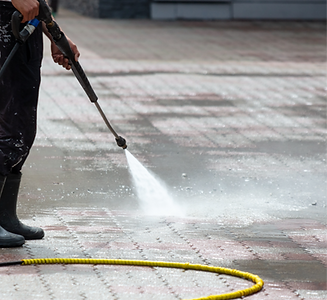 A man washes paving slabs with water_edi
