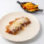 Milanesa de entrecot con queso trufado y huevo poché