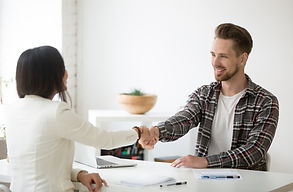 smiling-millennial-partners-handshaking-office-thanking-successful-teamwork.jpg