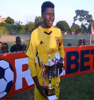 Masavu Football Club Player with Trophy won in a tournament