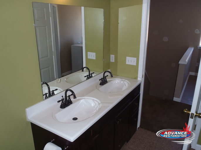 Before and After Photos of a Bathroom Rebuilt During a Water Mitigation Project in Ann Arbor, Michigan by Advance Restoration