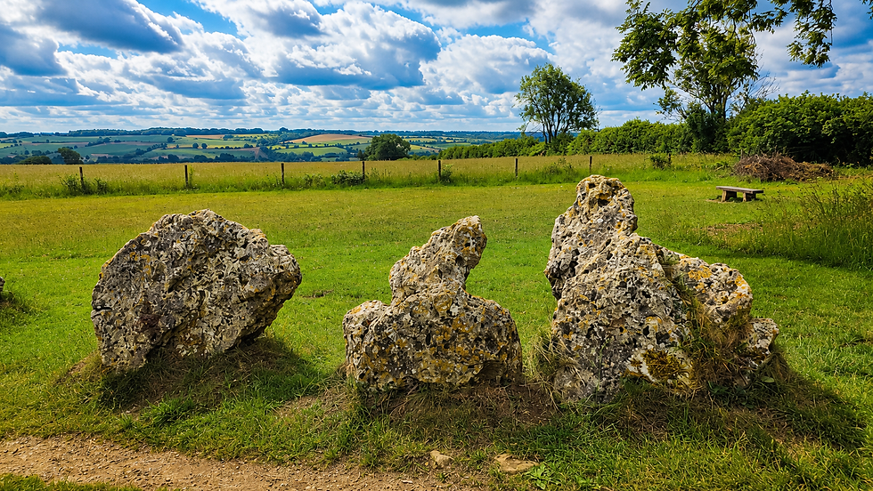Weathered stones of the King’s Men at the Rollright Stones, overlooking the rolling Cotswold landscape in Oxfordshire.