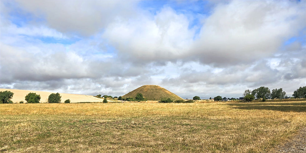 Silbury Hill rising above the surrounding fields near Avebury, Wiltshire, one of Europe's largest prehistoric artificial mounds and the focal point of a remarkable Neolithic ceremonial landscape.