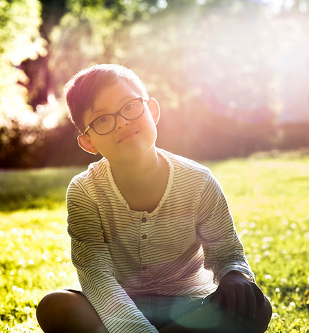 Child Sitting Outdoors