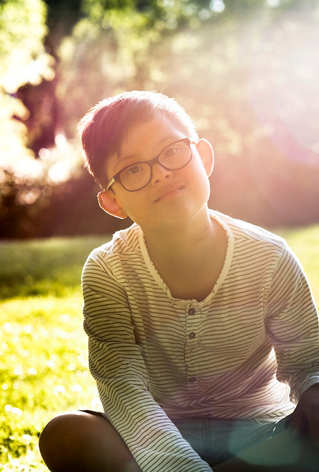 Boy Sitting on Grass