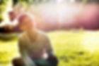 Boy Sitting on Grass