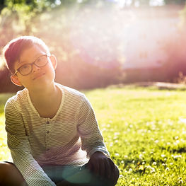 Child Sitting Outdoors