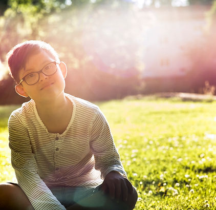 Boy Sitting on Grass