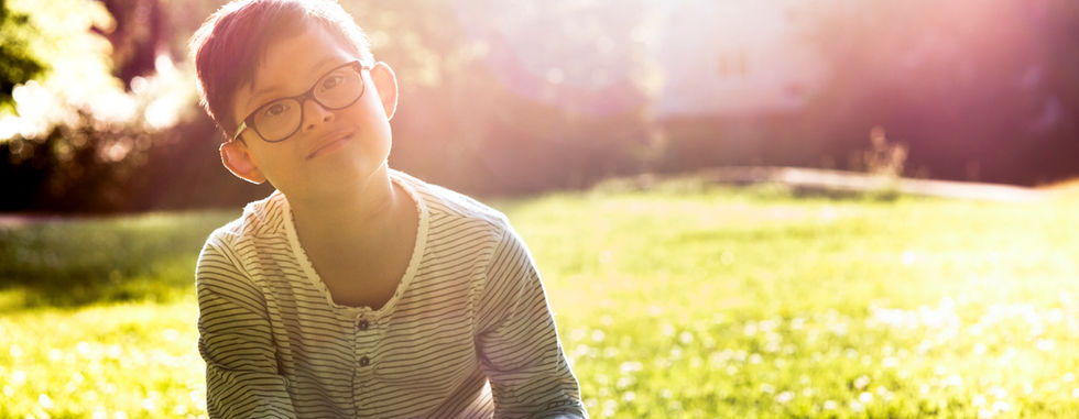 Boy Sitting on Grass