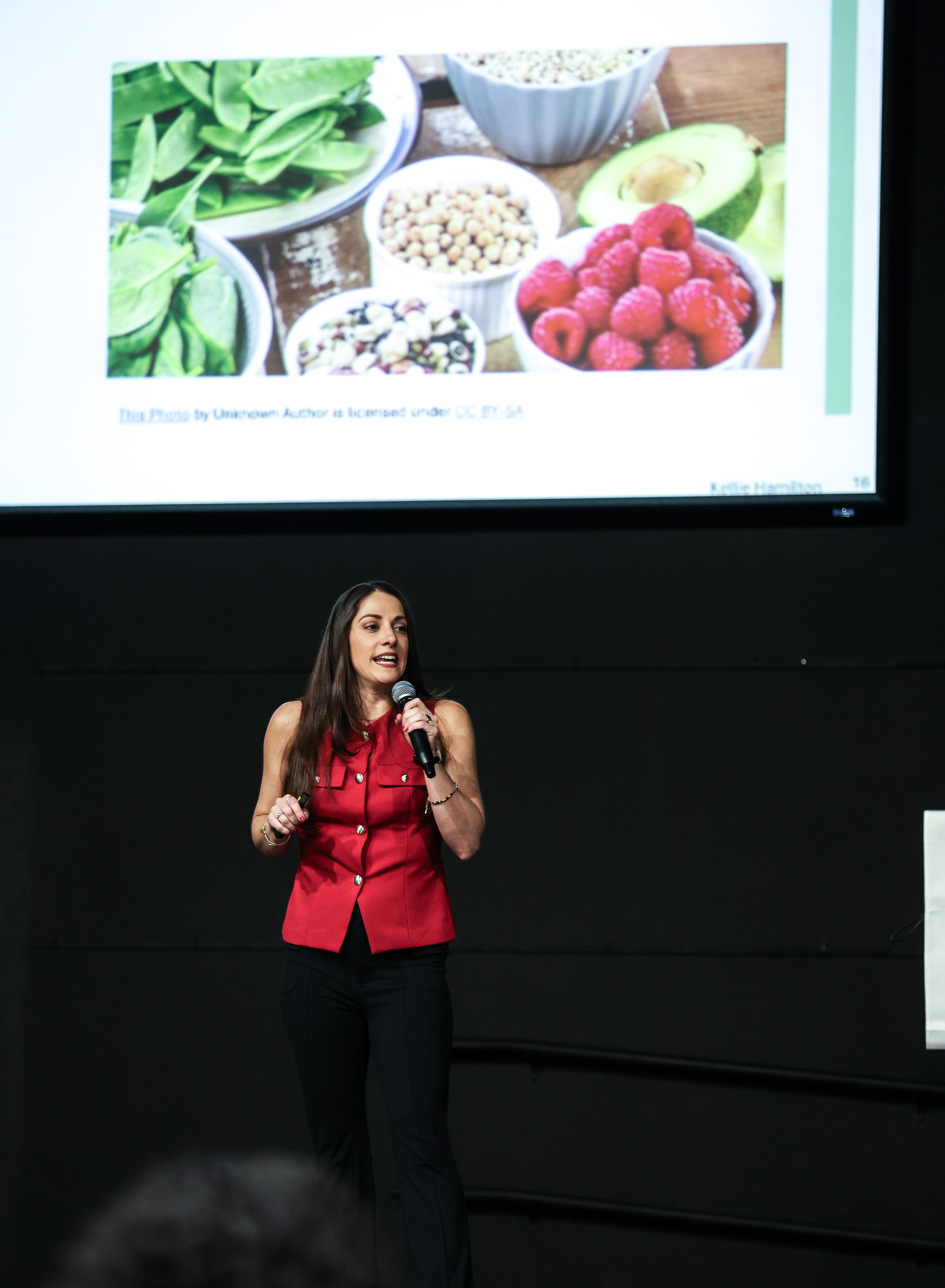 Kellie Hamilton speaking at a wellness event