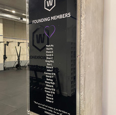 board-displaying-list-of-founding-members-on-wall-of-gym-at-the-workshop-crossfit-dublin