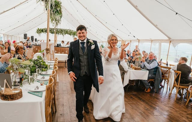 Married couple walking to wedding