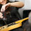 Thumbnail: Woman fixing her guitar using the retract-a-bit auto advance screwdriver