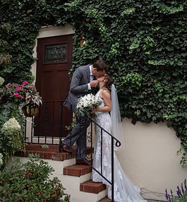 Couple share a kiss on staircase