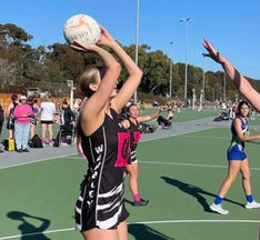 Wembley Netball Club goal shoot taking shot in Breast cancer awareness round  during Perth Netball Association winter competition at Matthews Netball Centre